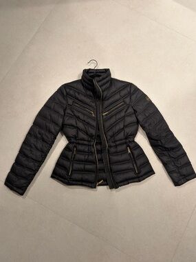 Michael kors Black puffer jacket with gold accents and adjustable waist